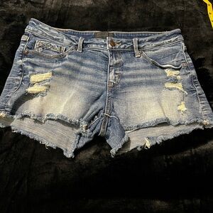 Buckle Black distressed jean shorts